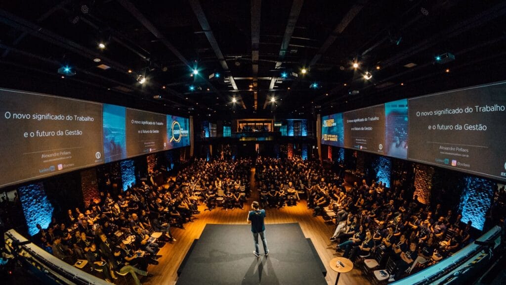 Speaker presenting at a large AI technology conference in 2026