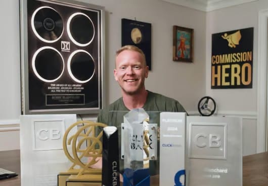 Robby Blanchard with his ClickBank affiliate awards, creator of Telehealth Profits and Commission Hero